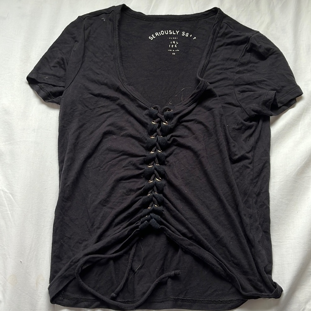 Stretchy black top with tie detail in the front size adult xs